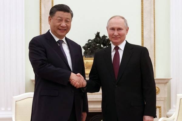 US says Xi’s visit to Putin gives ‘diplomatic cover’ for Russian war crimes